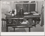 Pies, canned goods and household articles on stove in farm home. Bradford, Vermont, Orange County