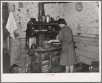 Preparing dinner in farm home of FSA (Farm Security Administration) client near Bradford, Vermont. Orange County