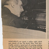 Walter Winchell in his car with police radio