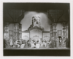 Cast members in interior Automat set in the stage production Face the Music