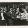 Ada "Bricktop" Smith, owner of the club Bricktop's on Rue Pigalle, Paris, with Fats Waller and others