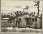 Temporary cabins in which clients live while new houses are being built. Wolf Creek Farms, Georgia