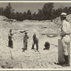 Farmers resettled on Skyline Farms, Alabama, at work in sand quarry under supervision of project manager