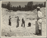 Farmers resettled on Skyline Farms, Alabama, at work in sand quarry under supervision of project manager