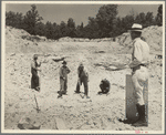 Farmers resettled on Skyline Farms, Alabama, at work in sand quarry under supervision of project manager