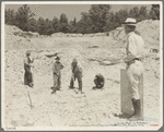 Farmers resettled on Skyline Farms, Alabama, at work in sand quarry under supervision of project manager