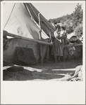 An Indian woman in front of her tepee. Many Indians on the Mescalero Reservation in New Mexico live in such primitive tents