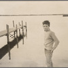 Scott Burton standing near dock at Jerome Robbins home in Water Mill, Long Island