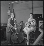 Jazz guitarist Mary Osborne in a recording session for Decca Records, featuring Burt Blake, bass; and Jack Pleis, piano