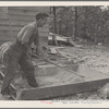Resettled farmer mixing cement. Cumberland Farms, Alabama. 1935