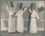 Three men in hats performing Gurdjieff Movements