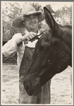 Resettled farmer clipping mule, Grady County, Georgia
