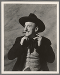 Jimmy Durante [with cigar, straightening cravat] in the stage production Jumbo