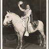 Paul Whiteman mounted on white horse in the stage production Jumbo