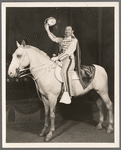 Paul Whiteman mounted on white horse in the stage production Jumbo