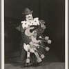 A. Robins [clown] with multiple mandolins in the stage production Jumbo