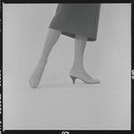 Woman modeling Pappagallo shoes
