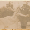 Loie Fuller lifted by two men