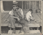 Sharecropper and child on porch of company house. Arkansas. 1935