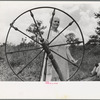 Rehabilitation client at spinning wheel, Ozark Mountains, Arkansas