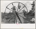 Rehabilitation client at spinning wheel, Ozark Mountains, Arkansas