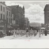 High school band parading up Montana Street, Butte, Montana