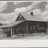 Resettled farmer with barn and team obtained through FSA (Farm Security Administration), Fairfield Bench Farms, Montana