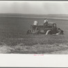Farmers spreading poison grasshopper bait, Richland County, Montana