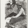 Dude girl "rassling" a calf, Quarter Circle U Ranch roundup, Montana