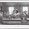 Sectioners at work canning grapefruit. About half of these girls are migrants. Winter Haven, Florida