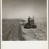 A farmer listing his fields under the wind erosion control program. He receives twenty cents an acre for the work. Liberal, Kansas