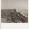 A farmer listing his fields under the wind erosion control program. He receives twenty cents an acre for the work. Liberal, Kansas