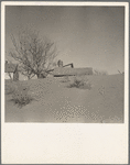 Large drifts of good Kansas top soil threaten to cover up this farmer's home. Kansas