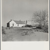 Shifting drifts of dust will soon force this farmer to abandon his home near Liberal, Kansas