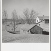 Soil blown by "dust bowl" winds piled up in large drifts near Liberal, Kansas