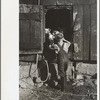 Bob McNally feeding the pigs, Kirby, Vt. Sept. 1937