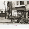 Pawnshop and milk wagon, Québec, Canada