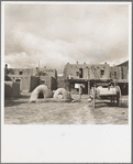 Pueblo at Taos, New Mexico. Ovens for cooking food in the foreground