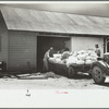 Loading supplies into shed, Wabash Farms, Indiana