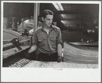 Steelworker at galvanizing machine, Pittsburgh, Pennsylvania