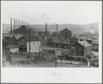 Center of town with steel plant behind business district, Midland, Pennsylvania