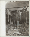 Sharecroppers being moved away from roadside by highway officials to area between levee and Mississippi River, New Madrid County, Missouri