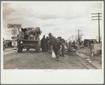 New Madrid County, Missouri. State highway officials moving sharecroppers away from roadside to area between the levee and the Mississippi River