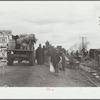 New Madrid County, Missouri. State highway officials moving sharecroppers away from roadside to area between the levee and the Mississippi River