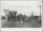 New Madrid County, Missouri. State highway officials moving sharecroppers away from roadside to area between the levee and the Mississippi River