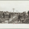 State highway officials moving sharecroppers from roadside to area between levee and Mississippi River, New Madrid County, Missouri