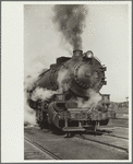 Locomotive in railroad yards along river, St. Louis, Missouri