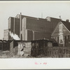 Squatters' shacks with grain elevator in background, Saint Louis, Missouri