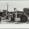 Farmer and family look at machinery on exhibition, Central Iowa 4-H Club fair, Marshalltown, Iowa