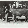 4-H Club boy with calf at baby beef auction, Central Iowa 4-H Club fair, Marshalltown, Iowa